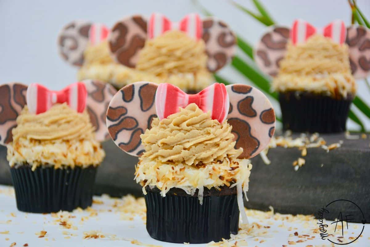 GF Minnnie Mouse safari cupcakes with shredded coconut and peanut butter icing.